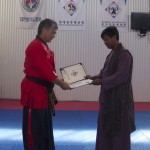 Master Michael Tan receiving his Kumdo Instructors certificate from Master Peter